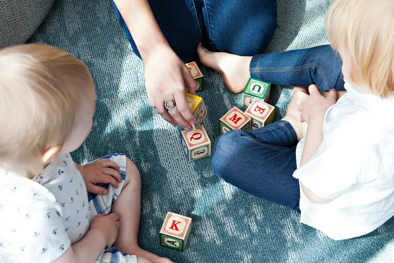 A person holding a baby, illustrating evidence-based childcare practice